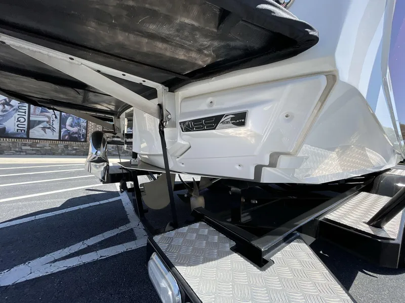 Slide: The Image of 2017 Nautique Super Air G23 boat trailer detail with metallic accents. - 9