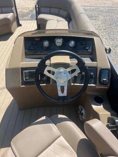 Slide: The Image of 2017 Bennington 24 SSBXP boat dashboard with steering wheel and control panel. - 4