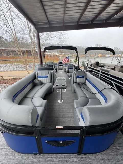 Slide: The Image of 2025 Bennington 24 LXSFB pontoon boat with spacious seating and modern design. - 3