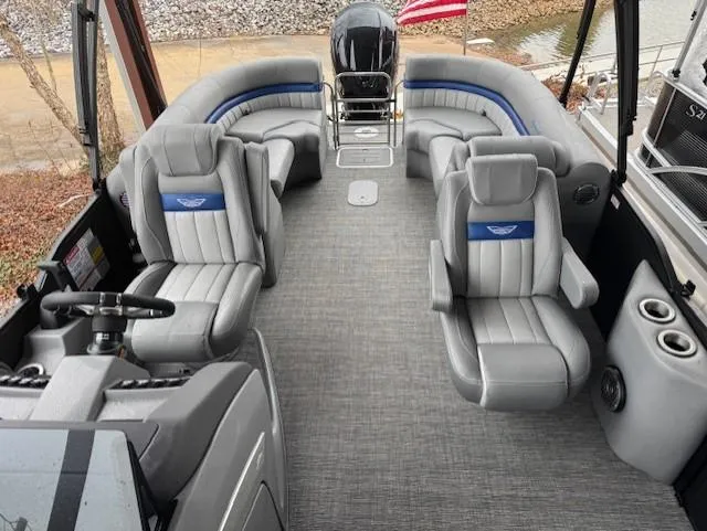Slide: The Image of 2025 Bennington 24 LXSFB pontoon boat interior with luxurious gray seating and modern design. - 7