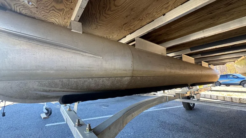 Slide: The Image of Underneath view of a 2003 Godfrey Sweet Water pontoon boat on a trailer. - 5