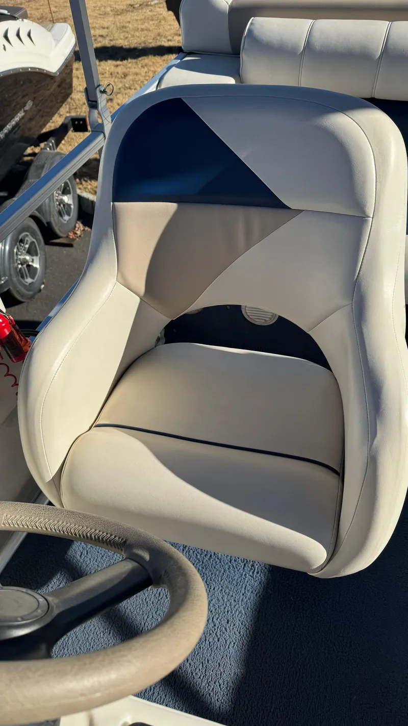 Slide: The Image of 2003 Godfrey Sweet Water boat seat with blue and beige upholstery. - 9
