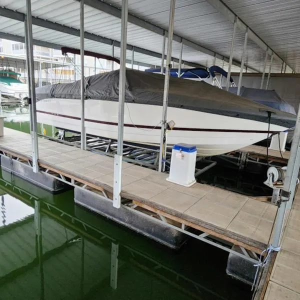 Slide: The Image of 2007 Cobalt 282 boat covered and docked in a marina. - 1