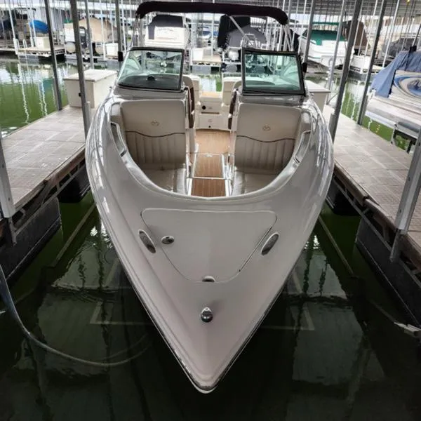 Slide: The Image of 2007 Cobalt 282 boat docked in marina, front view, sleek design. - 10