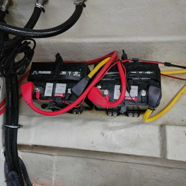 Slide: The Image of Dual batteries with red and yellow cables in a 2007 Cobalt 282 boat. - 11