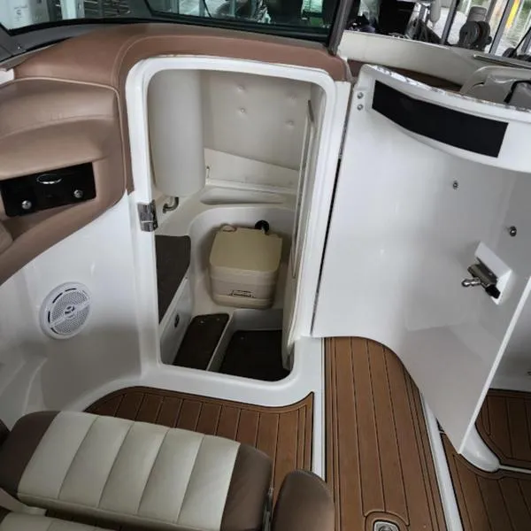Slide: The Image of 2007 Cobalt 282 boat interior with open storage compartment and seating. - 12