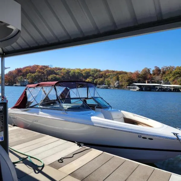 Slide: The Image of 2007 Cobalt 282 boat docked on a scenic lake with autumn foliage. - 3
