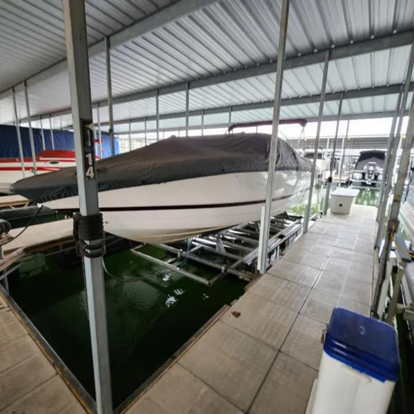 Slide: The Image of 2007 Cobalt 282 boat covered and docked in a marina. - 9