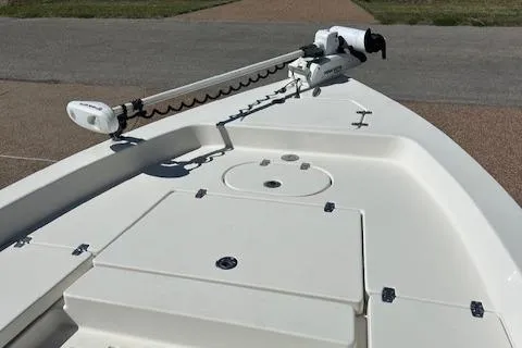 Slide: The Image of 2013 Pathfinder 2400 TRS boat deck with trolling motor, showcasing spacious layout and storage. - 2