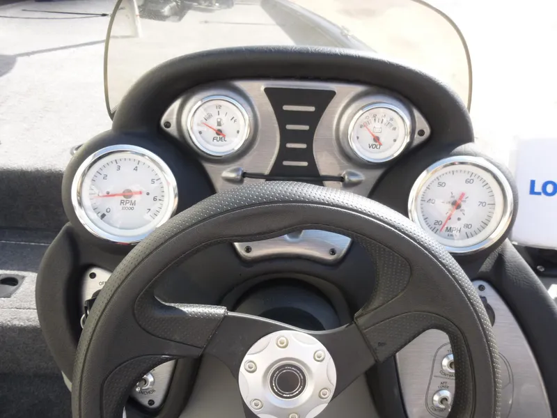 Slide: The Image of 2016 Tracker Pro Team 195 TXW dashboard with steering wheel and gauges. - 11