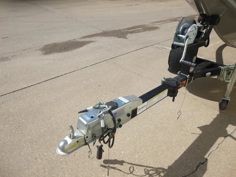 Slide: The Image of Trailer hitch of 2016 Tracker Pro Team 195 TXW boat on pavement. - 20