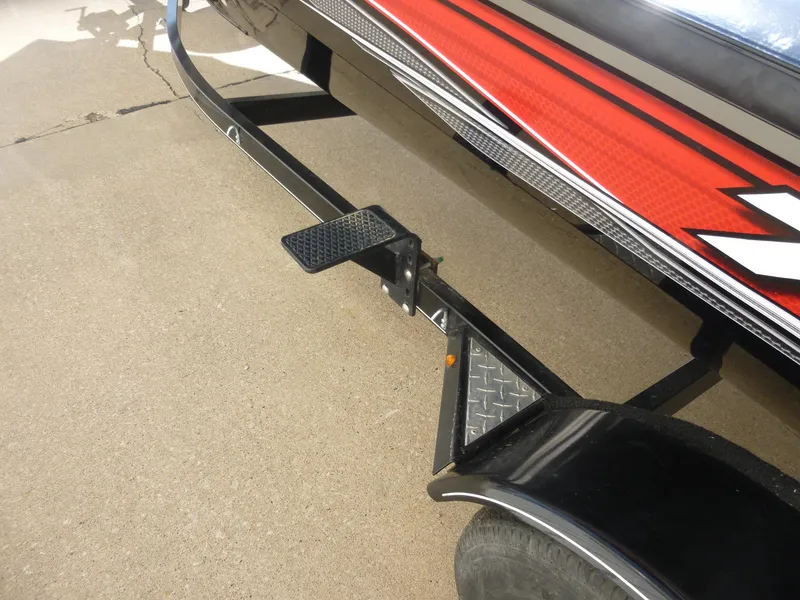 Slide: The Image of 2016 Tracker Pro Team 195 TXW boat trailer with step and red detailing. - 25