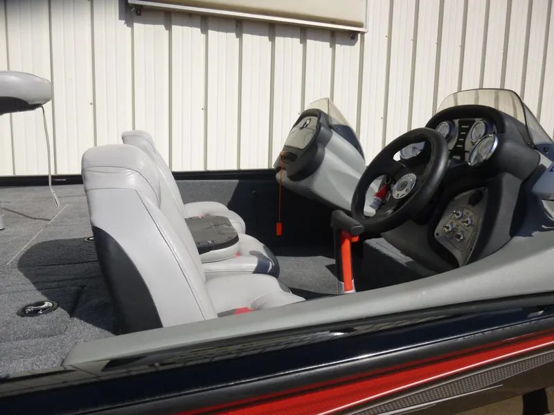 Slide: The Image of 2016 Tracker Pro Team 195 TXW boat interior with steering wheel and seats. - 26
