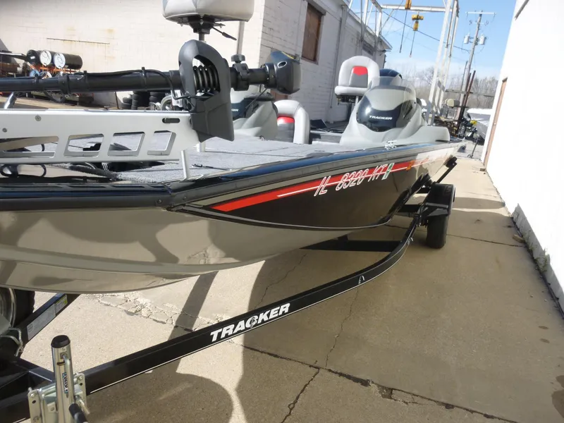 Slide: The Image of 2016 Tracker Pro Team 195 TXW boat on trailer, parked outdoors. - 28