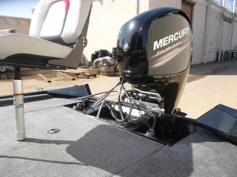 Slide: The Image of 2016 Tracker Pro Team 195 TXW boat with Mercury engine and cushioned seat. - 29