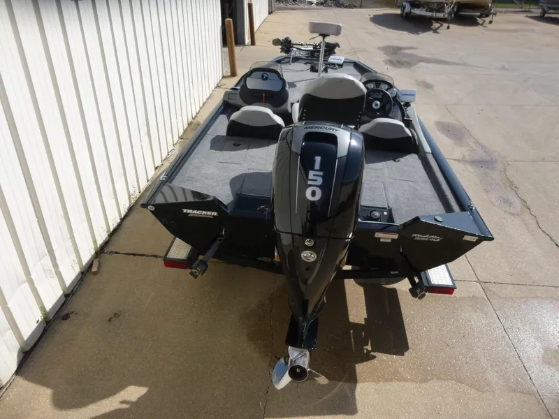 Slide: The Image of 2016 Tracker Pro Team 195 TXW boat with 150 HP engine, parked on concrete. - 3