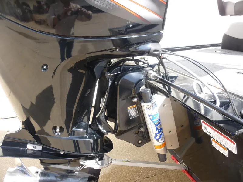 Slide: The Image of 2016 Tracker Pro Team 195 TXW boat engine close-up, showcasing motor and hydraulic components. - 31