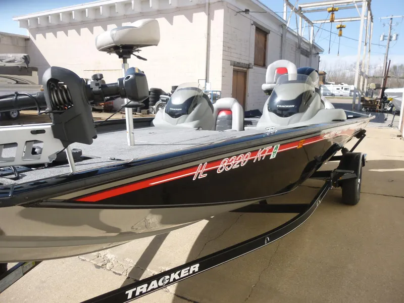Slide: The Image of 2016 Tracker Pro Team 195 TXW fishing boat on trailer, parked outdoors. - 5