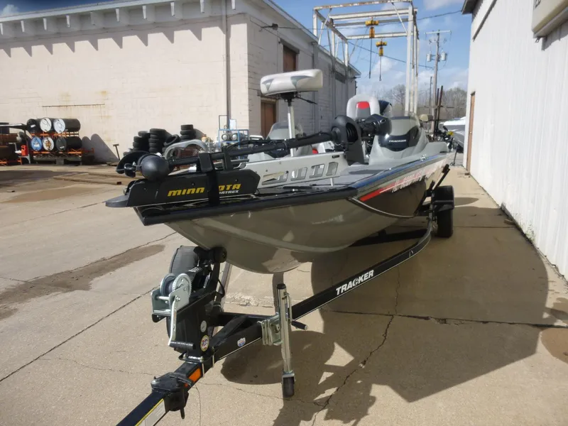 Slide: The Image of 2016 Tracker Pro Team 195 TXW boat on trailer, parked outdoors. - 7