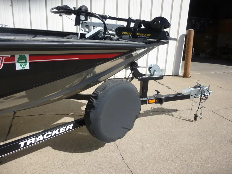 Slide: The Image of 2016 Tracker Pro Team 195 TXW boat on trailer, featuring a Minn Kota trolling motor. - 8
