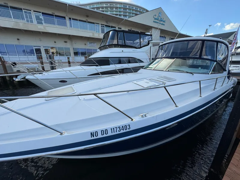 Slide: The Image of 2004 Formula 40 PC yacht docked at marina, sleek design, clear skies. - 11