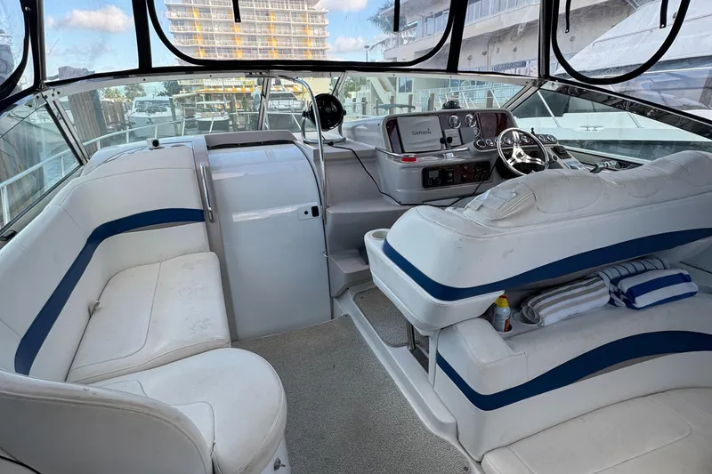 Slide: The Image of 2004 Formula 40 PC yacht interior with white seating and modern dashboard. - 12