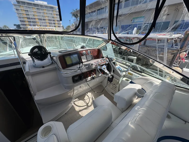 Slide: The Image of 2004 Formula 40 PC yacht cockpit with modern navigation equipment and comfortable seating. - 14