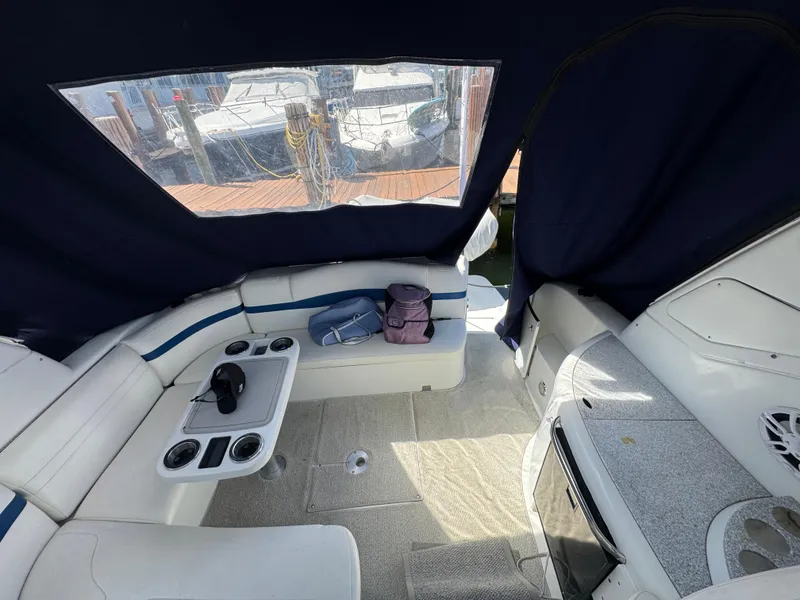Slide: The Image of Interior of 2004 Formula 40 PC boat with seating and table, docked at marina. - 15