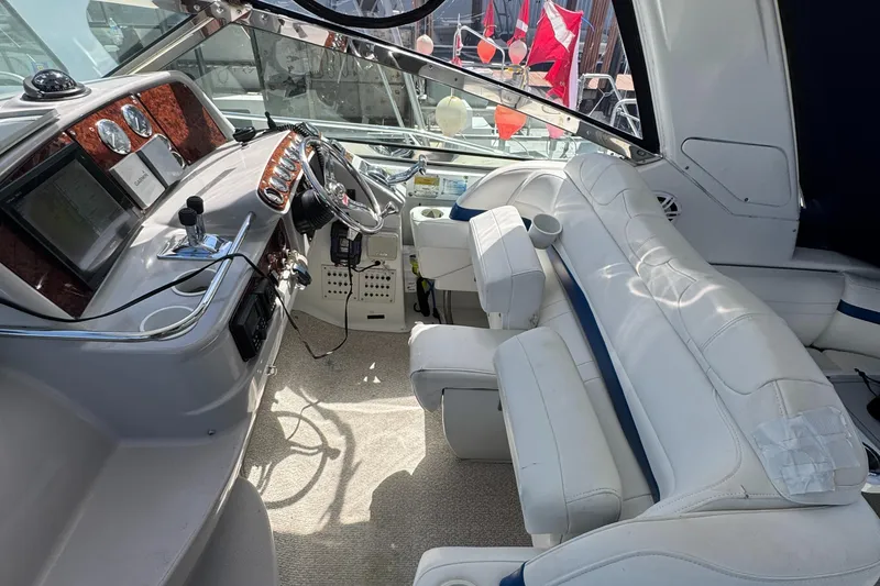 Slide: The Image of 2004 Formula 40 PC yacht interior with white seating and modern dashboard controls. - 17