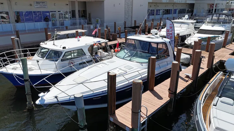 Slide: The Image of 2004 Formula 40 PC yacht docked at marina with other boats. - 2