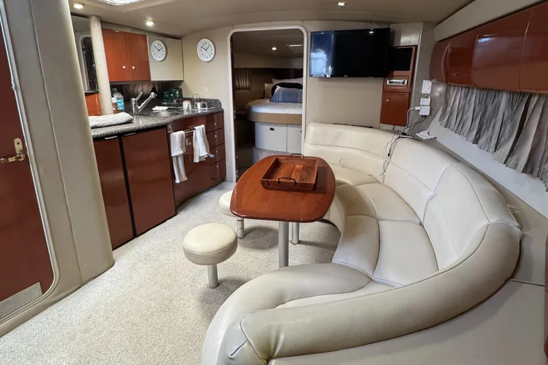 Slide: The Image of Luxurious 2004 Formula 40 PC yacht interior with kitchen, seating, and bedroom. - 21