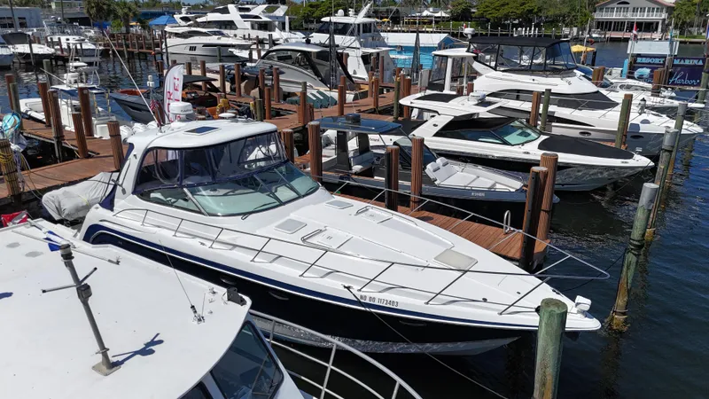 Slide: The Image of 2004 Formula 40 PC yacht docked at marina with other boats. - 6