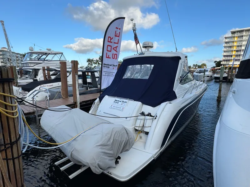 Slide: The Image of 2004 Formula 40 PC yacht for sale at marina, featuring sleek design and covered deck. - 9