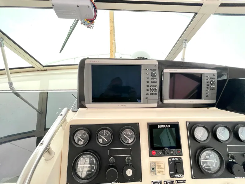 Slide: The Image of Control panel of a 1999 Henriques 28 Express Sportfish with navigation instruments. - 6