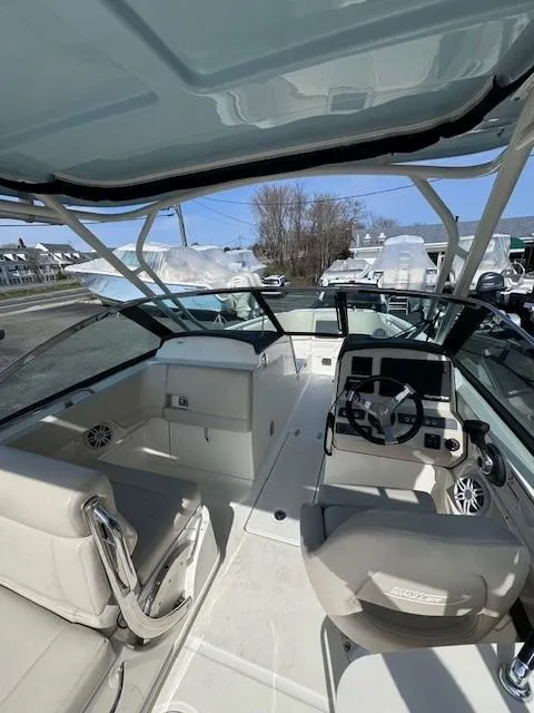 Slide: The Image of 2019 Boston Whaler 230 Vantage boat interior with seating and steering wheel. - 10