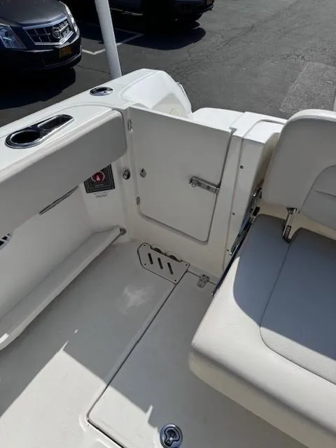 Slide: The Image of 2019 Boston Whaler 230 Vantage boat interior with seating and storage compartments. - 13