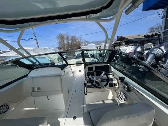 Slide: The Image of 2019 Boston Whaler 230 Vantage boat interior with steering wheel and seating. - 3