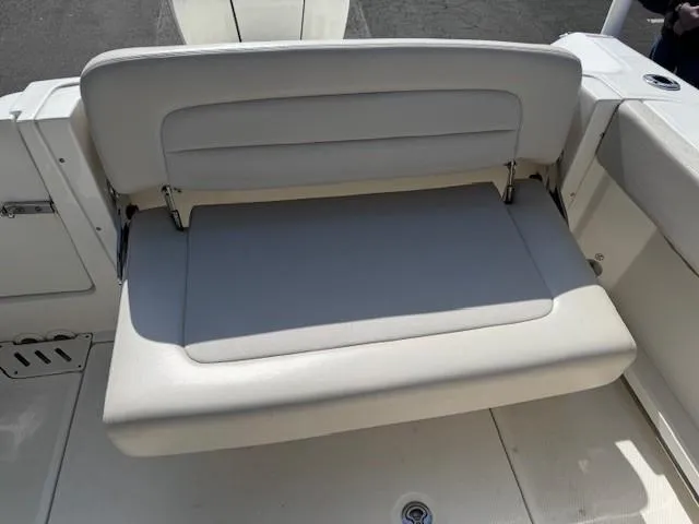 Slide: The Image of 2019 Boston Whaler 230 Vantage boat seat, beige upholstery, rear view. - 7
