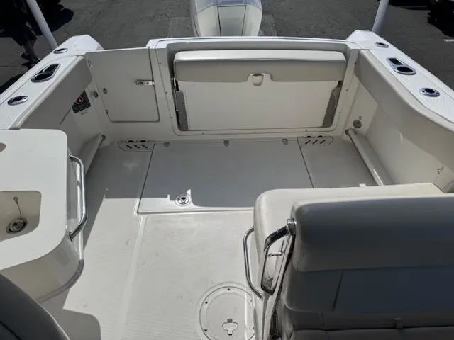 Slide: The Image of 2019 Boston Whaler 230 Vantage boat interior, featuring spacious seating and storage areas. - 8