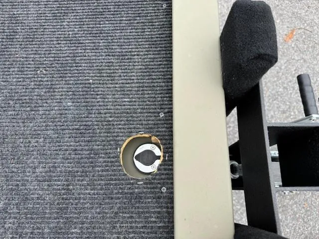 Slide: The Image of 2024 Tracker Grizzly 1436 Jon boat interior with carpeted flooring and a metal fixture. - 3