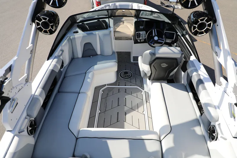 Slide: The Image of 2019 Malibu Wakesetter 21 VLX interior with sleek seating and modern dashboard. - 11