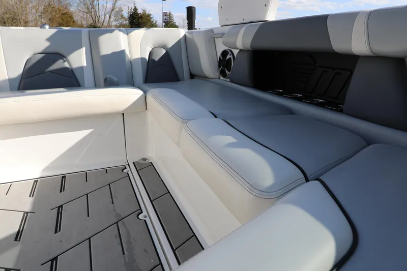 Slide: The Image of 2019 Malibu Wakesetter 21 VLX interior with gray and white seating and flooring. - 14