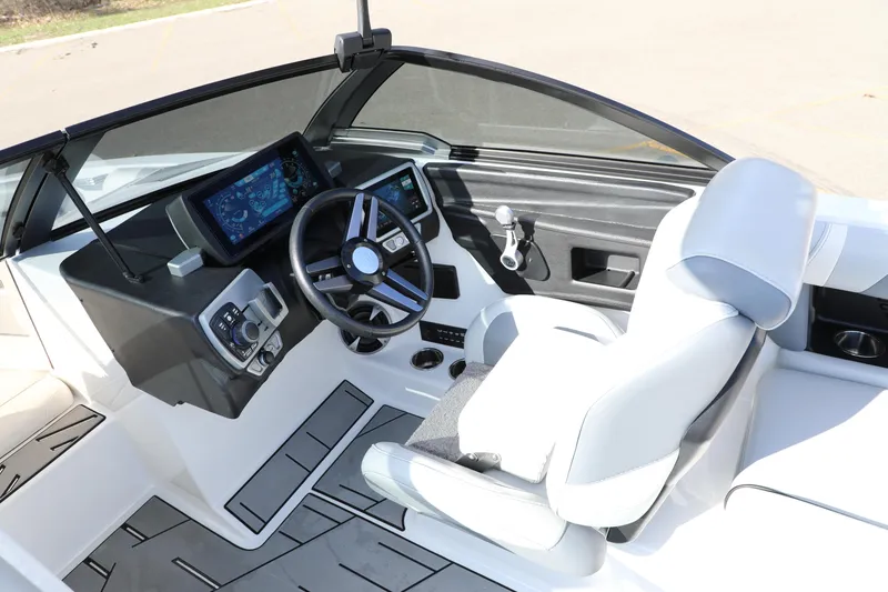 Slide: The Image of 2019 Malibu Wakesetter 21 VLX boat interior with modern dashboard and steering wheel. - 18