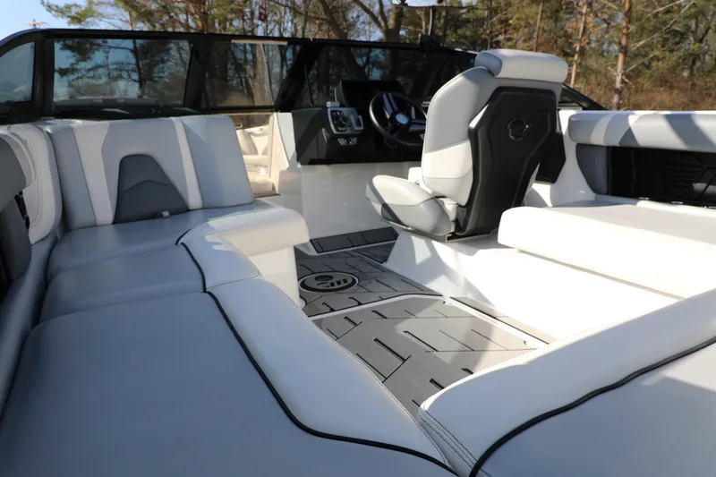 Slide: The Image of 2019 Malibu Wakesetter 21 VLX boat on trailer, rear view, parked outdoors. - 2