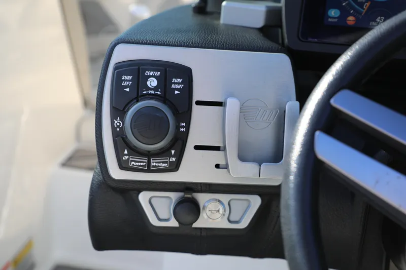 Slide: The Image of Control panel of a 2019 Malibu Wakesetter 21 VLX boat, featuring navigation buttons. - 22