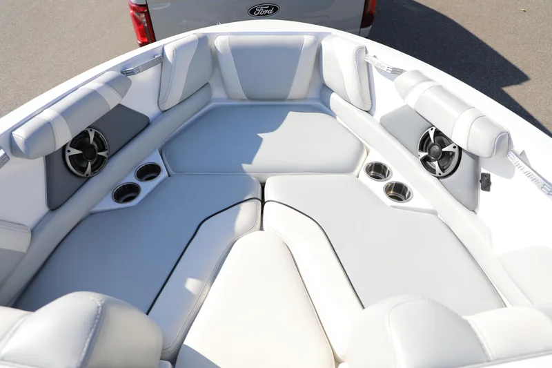 Slide: The Image of 2019 Malibu Wakesetter 21 VLX boat interior with white leather seating and cup holders. - 23