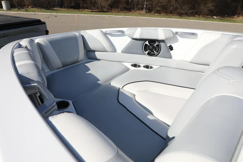 Slide: The Image of 2019 Malibu Wakesetter 21 VLX interior with white seating and speaker system. - 8