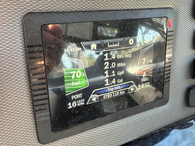Slide: The Image of Dashboard display of a 2018 Yamaha Boats SX210 showing fuel level and trip information. - 16