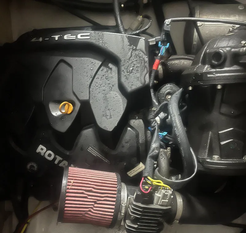 Slide: The Image of Engine of a 2015 Scarab 165 with visible components and wiring. - 13