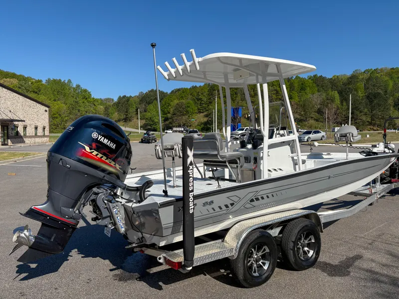 Slide: The Image of 2023 Xpress H22 boat with Yamaha engine on trailer, parked outdoors. - 4